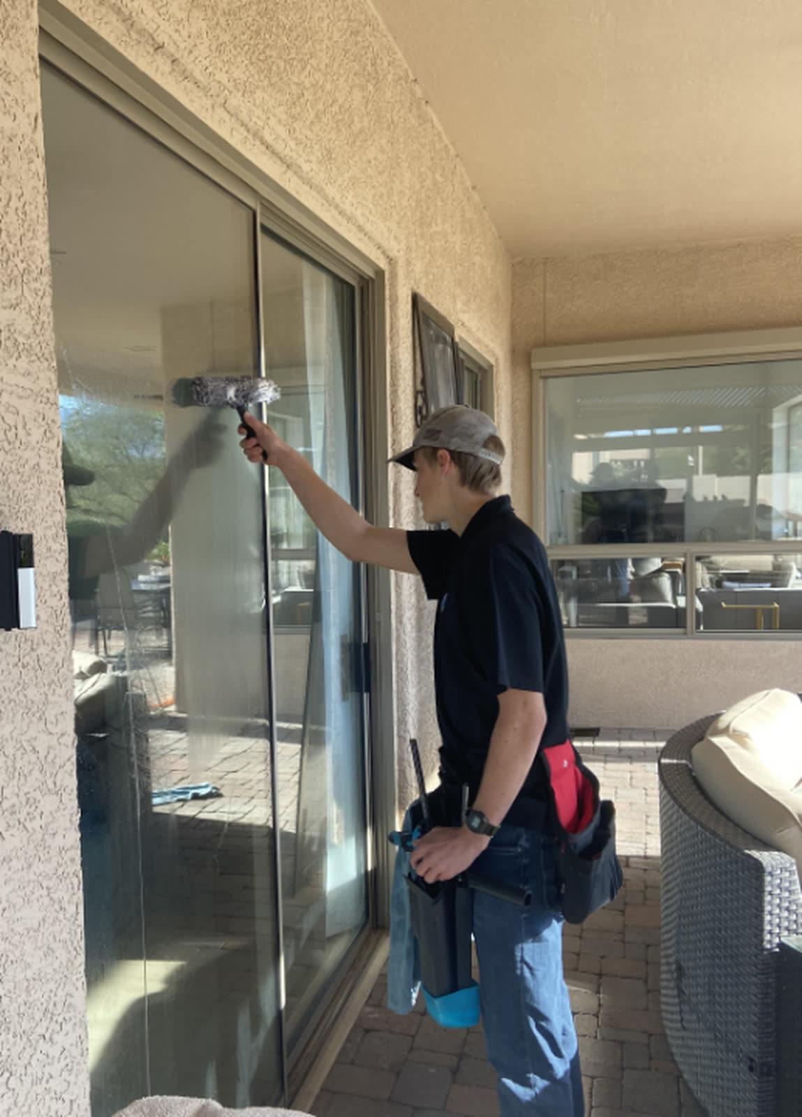 Pane Point cleaning a Tucson home's windows